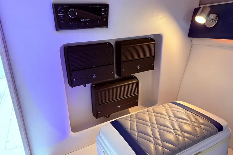 Slide: The Image of Interior of 2008 Sleekcraft 34' Heritage boat with audio system and cushioned seating. - 18