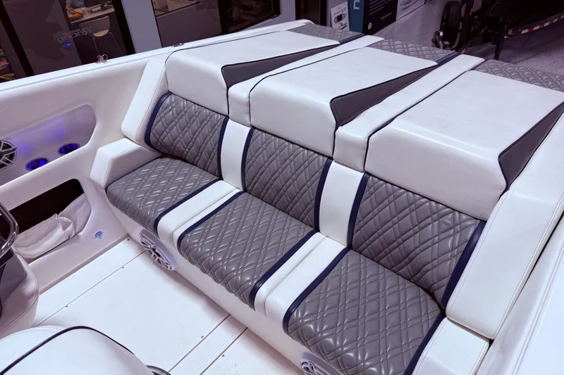 Slide: The Image of Luxurious seating in a 2008 Sleekcraft 34' Heritage boat, featuring quilted upholstery. - 23