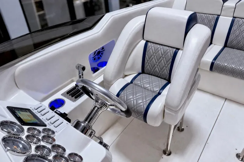 Slide: The Image of Luxurious 2008 Sleekcraft 34' Heritage boat interior with modern dashboard and plush seating. - 32