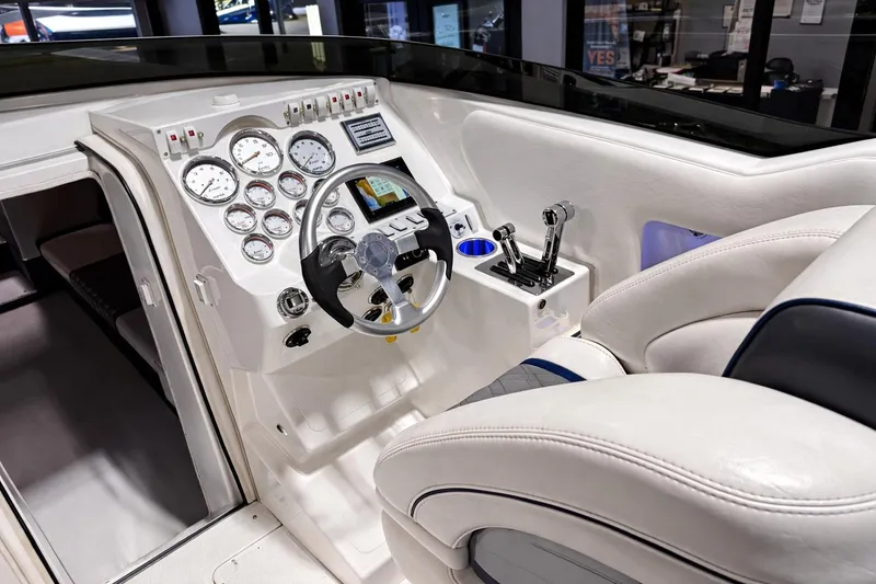 Slide: The Image of Interior cockpit of 2008 Sleekcraft 34' Heritage boat with steering wheel and control panel. - 8