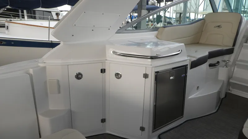 Slide: The Image of Interior of 2019 Monterey 295 Sport Yacht with seating area. - 15