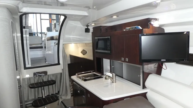 Slide: The Image of Interior of 2019 Monterey 295 Sport Yacht with modern kitchen. - 18