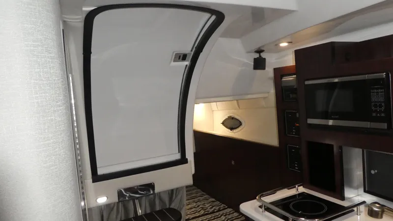 Slide: The Image of Interior of 2019 Monterey 295 Sport Yacht featuring modern kitchen. - 19