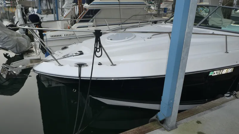 Slide: The Image of 2019 Monterey 295 Sport Yacht docked at marina. - 2