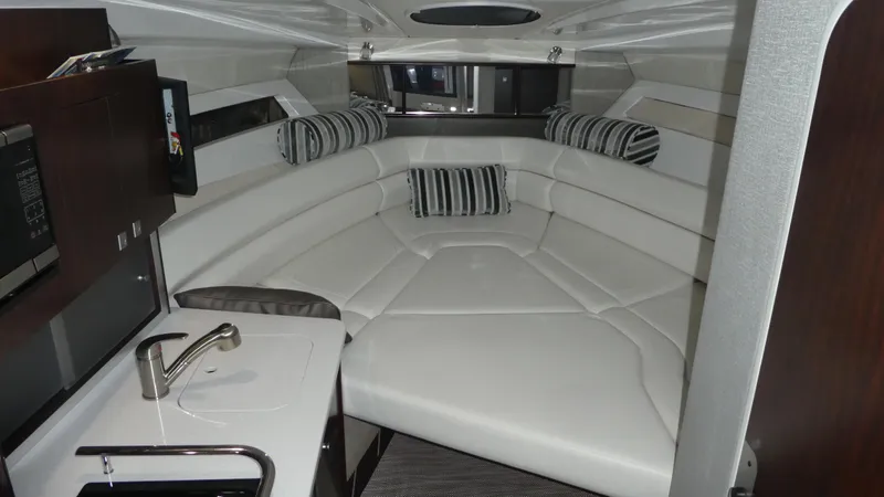 Slide: The Image of Interior of 2019 Monterey 295 Sport Yacht with white upholstery. - 27