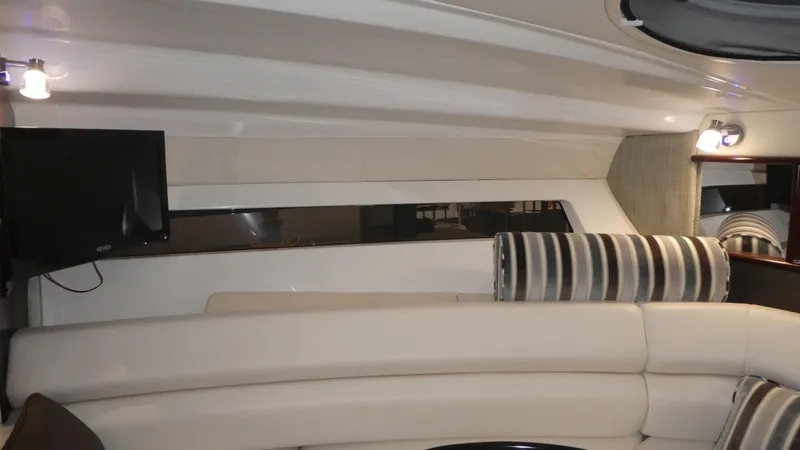 Slide: The Image of Interior of 2019 Monterey 295 Sport Yacht with sofa and TV. - 29