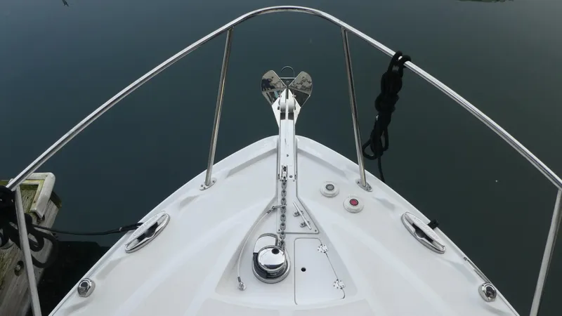 Slide: The Image of Bow view of 2019 Monterey 295 Sport Yacht on calm water. - 3