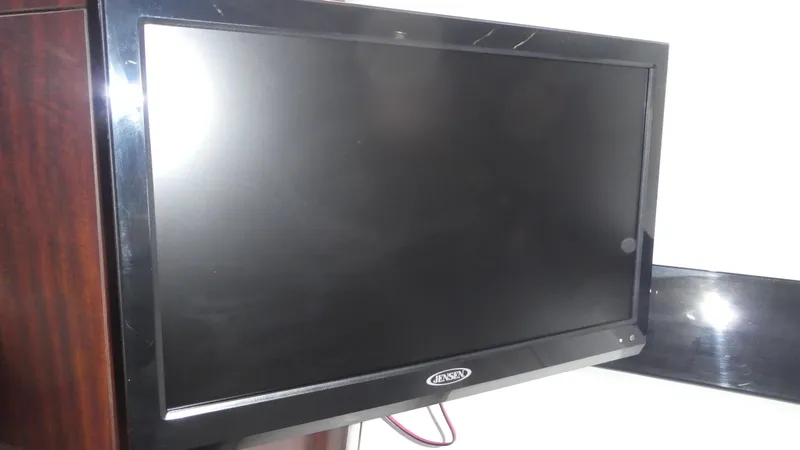 Slide: The Image of Flat-screen TV in 2019 Monterey 295 Sport Yacht interior. - 32