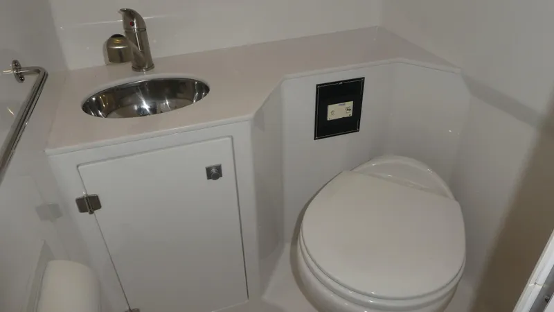 Slide: The Image of 2019 Monterey 295 Sport Yacht bathroom with sink and toilet. - 36