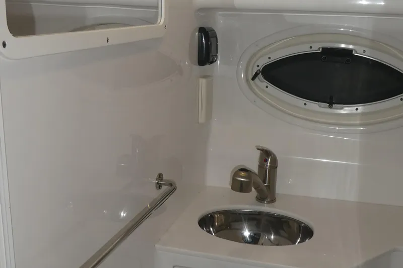 Slide: The Image of Interior of 2019 Monterey 295 Sport Yacht with sink and window. - 40