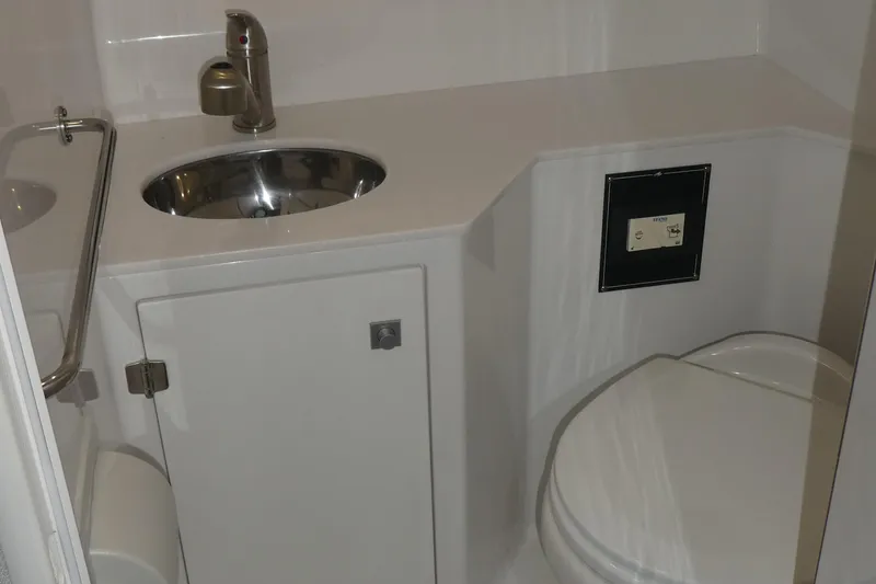 Slide: The Image of Interior of 2019 Monterey 295 Sport Yacht with sink and toilet. - 42