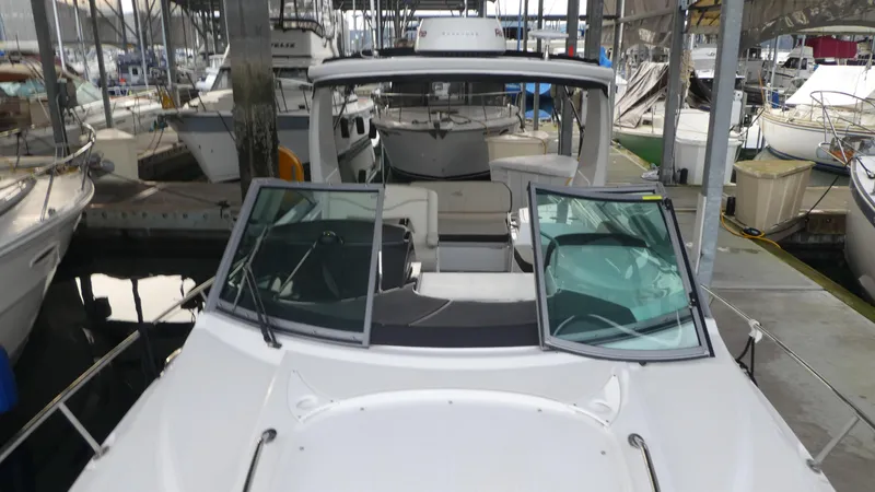 Slide: The Image of 2019 Monterey 295 Sport Yacht docked, front view. - 6