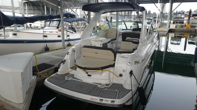 Slide: The Image of 2019 Monterey 295 Sport Yacht docked, sleek design. - 7