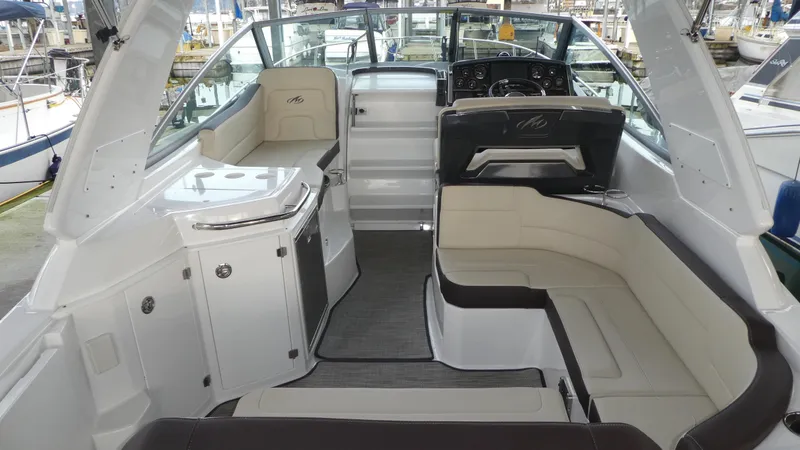 Slide: The Image of Interior of 2019 Monterey 295 Sport Yacht with luxurious seating. - 8