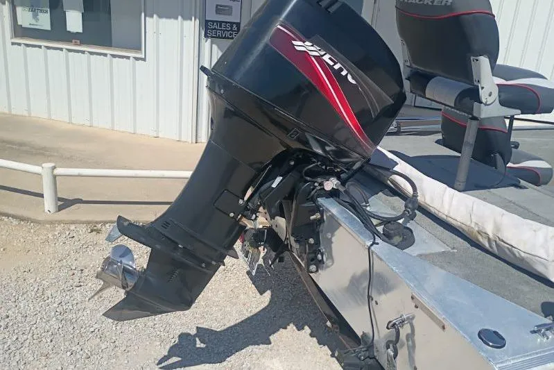 Slide: The Image of 2007 Tracker Pro Team 175 boat with outboard motor, parked near sales and service building. - 10