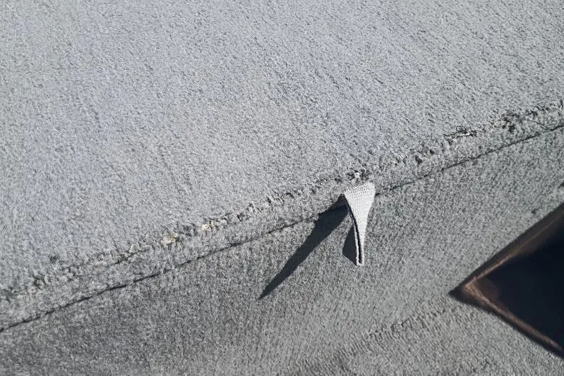 Slide: The Image of Close-up of a 2007 Tracker Pro Team 175 boat cover with visible stitching. - 5