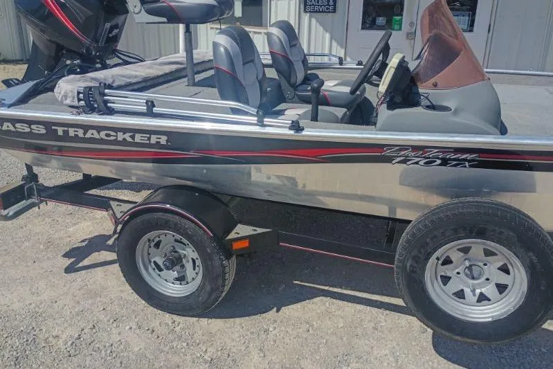 Slide: The Image of 2007 Tracker Pro Team 175 boat on trailer, parked outside a building. - 6