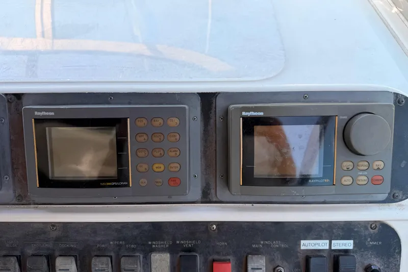 Slide: The Image of Control panel of a 1996 Sea Ray 450 Sundancer with Raytheon navigation systems. - 20