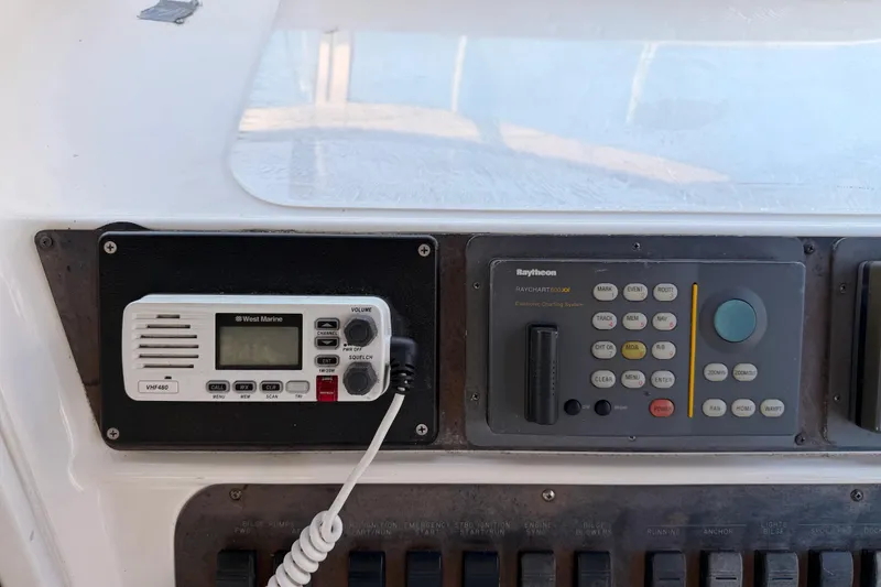 Slide: The Image of Control panel of a 1996 Sea Ray 450 Sundancer with marine radio and navigation system. - 21