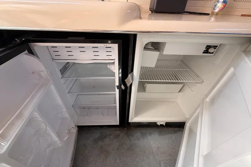 Slide: The Image of Open refrigerator in 1996 Sea Ray 450 Sundancer yacht kitchen area. - 29