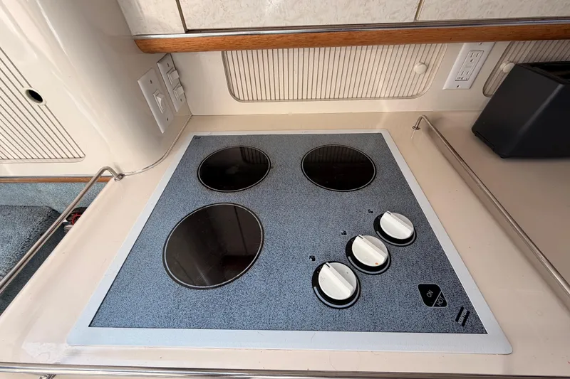 Slide: The Image of Electric stovetop in 1996 Sea Ray 450 Sundancer yacht kitchen. - 30