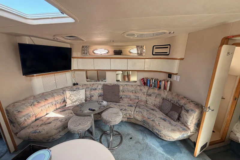 Slide: The Image of Luxurious 1996 Sea Ray 450 Sundancer interior with plush seating and modern amenities. - 32