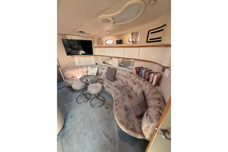 Slide: The Image of Luxurious interior of 1996 Sea Ray 450 Sundancer yacht with plush seating and modern amenities. - 36