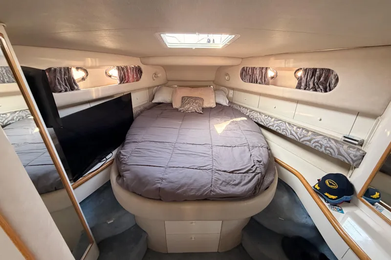 Slide: The Image of Interior cabin of 1996 Sea Ray 450 Sundancer with cozy bed and modern amenities. - 42