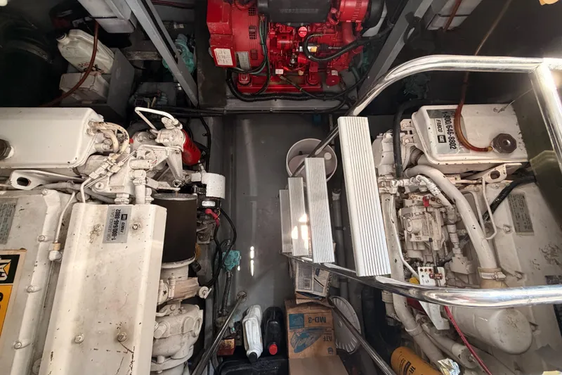 Slide: The Image of Engine room of a 1996 Sea Ray 450 Sundancer with visible machinery and components. - 51