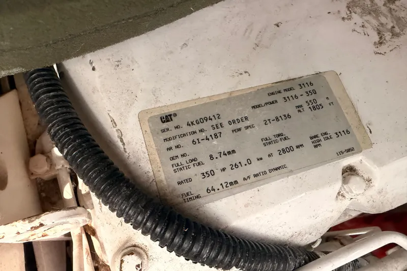 Slide: The Image of Engine label on a 1996 Sea Ray 450 Sundancer, displaying specifications and serial numbers. - 56