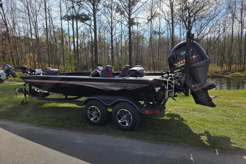 Slide: The Image of 2026 Ranger RT198P boat parked outdoors on a trailer. - 2