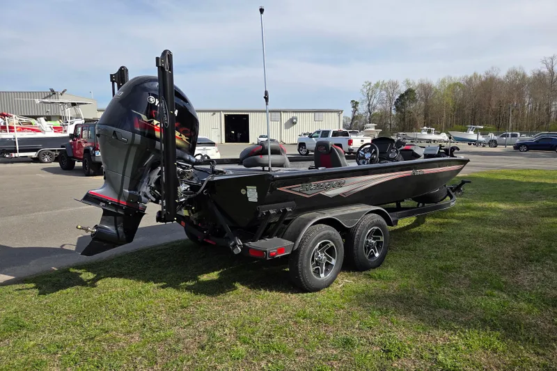 Slide: The Image of 2026 Ranger RT198P boat on trailer, parking lot in background. - 4
