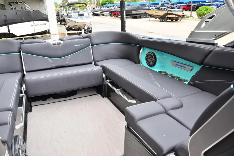 Slide: The Image of 2017 MasterCraft X26 boat interior with sleek seating and modern design. - 11