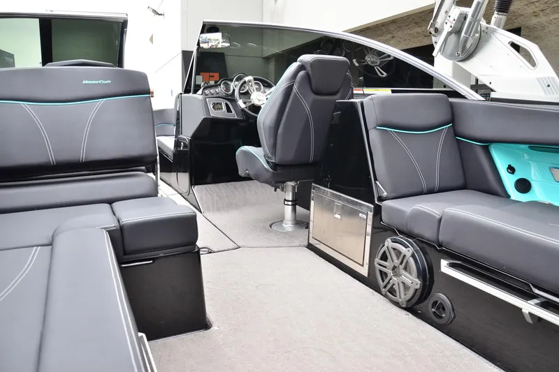 Slide: The Image of Interior of a 2017 MasterCraft X26 boat with luxurious seating and modern design. - 13