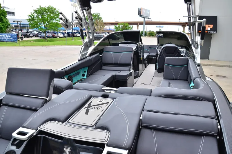 Slide: The Image of 2017 MasterCraft X26 boat interior with luxurious seating and modern design. - 17
