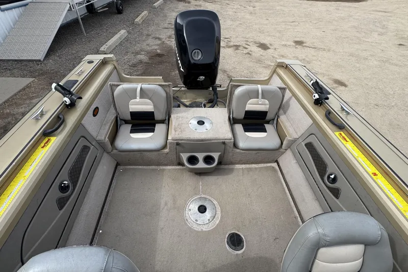 Slide: The Image of 2007 Tracker Targa 175 Sport boat interior with seating and motor view. - 11