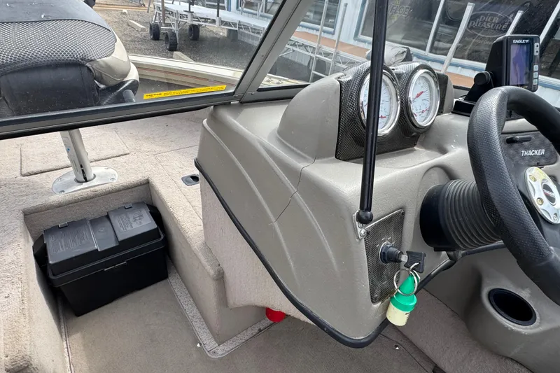 Slide: The Image of 2007 Tracker Targa 175 Sport boat dashboard with gauges and steering wheel. - 8