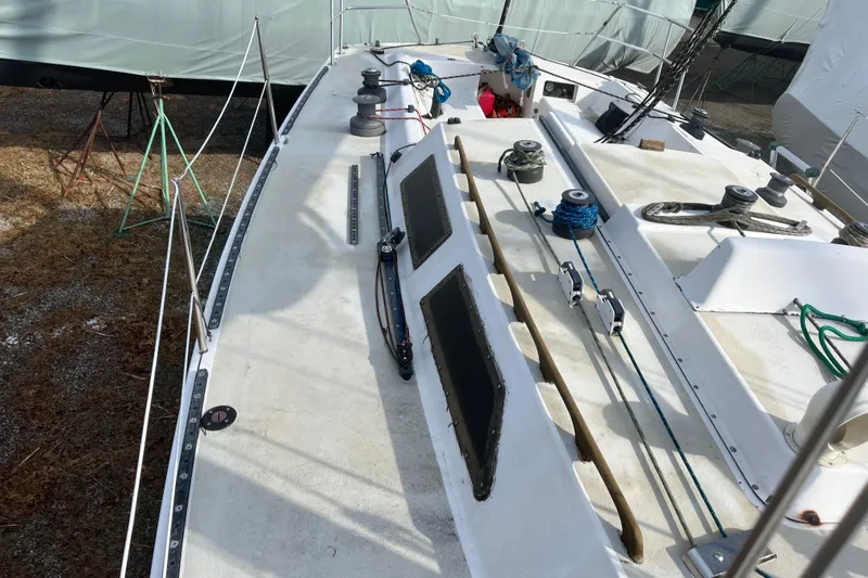 Slide: The Image of 1986 Alsberg Brothers Express 37 sailboat deck with winches and rigging equipment. - 12