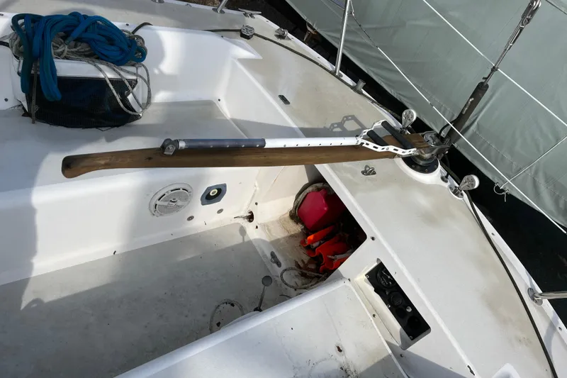Slide: The Image of Cockpit of 1986 Alsberg Brothers Express 37 sailboat with ropes and tiller. - 31