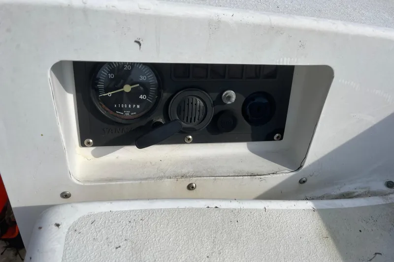Slide: The Image of Control panel of a 1986 Alsberg Brothers Express 37 sailboat, featuring RPM gauge. - 36