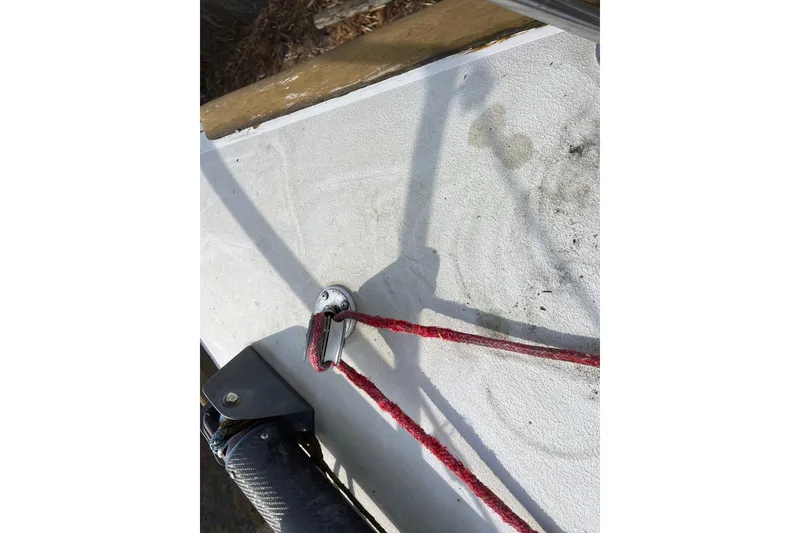 Slide: The Image of Close-up of Alsberg Brothers Express 37 sailboat deck with red rope and hardware, 1986 model. - 38