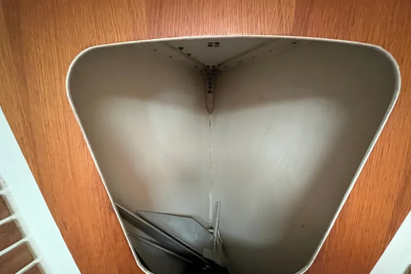 Slide: The Image of Interior view of Alsberg Brothers Express 37 sailboat, 1986 model, featuring wooden paneling. - 42