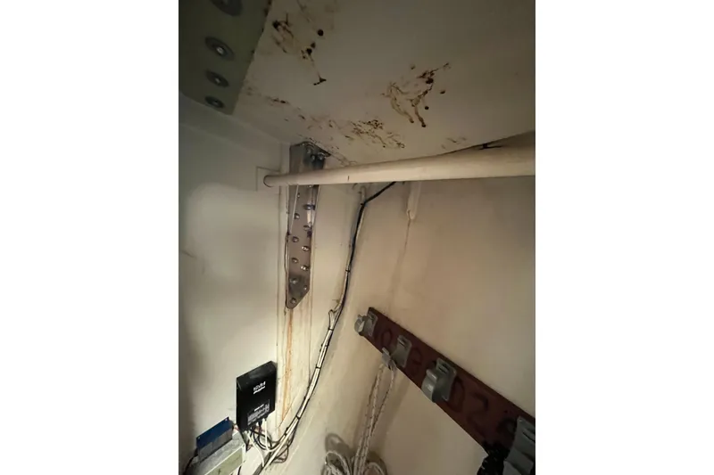 Slide: The Image of Interior view of 1986 Alsberg Brothers Express 37 sailboat, showing wiring and structural components. - 49