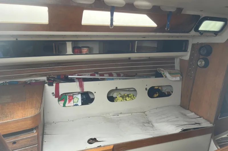 Slide: The Image of Interior of 1986 Alsberg Brothers Express 37 sailboat with storage and seating area. - 50