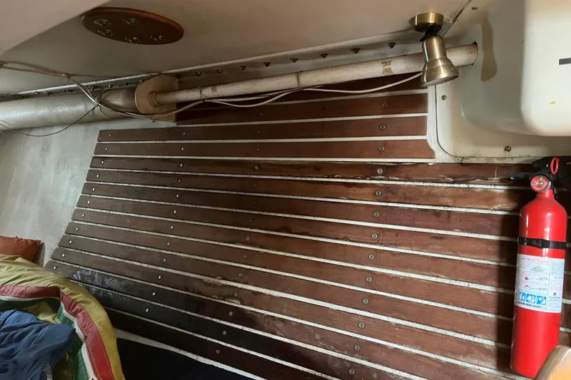 Slide: The Image of Interior of 1986 Alsberg Brothers Express 37 sailboat with wood paneling and fire extinguisher. - 56