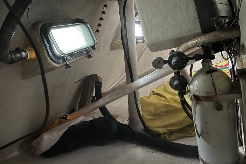 Slide: The Image of Interior of 1986 Alsberg Brothers Express 37 sailboat, showing equipment and porthole. - 57