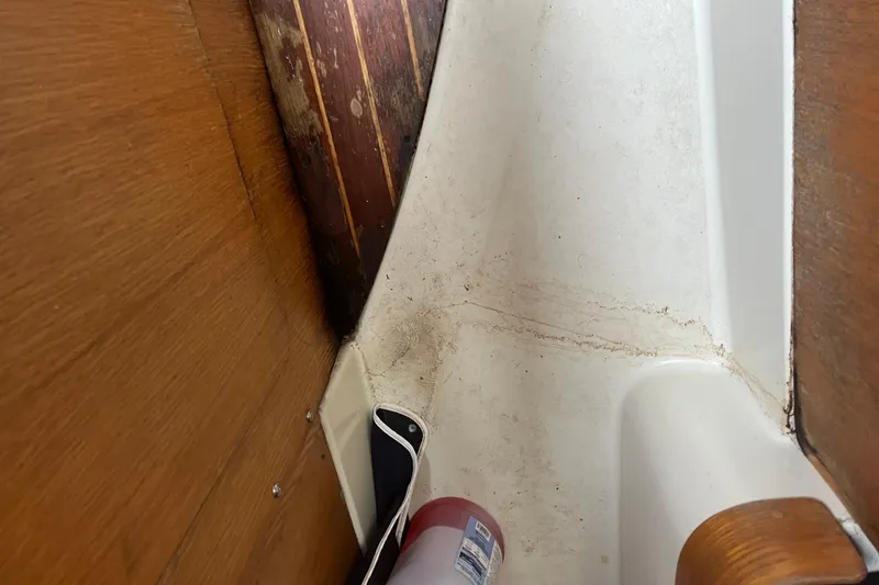 Slide: The Image of Interior of 1986 Alsberg Brothers Express 37 sailboat with wooden paneling and fire extinguisher. - 61