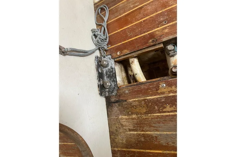 Slide: The Image of Interior view of 1986 Alsberg Brothers Express 37 sailboat, showing wooden paneling and hardware. - 64