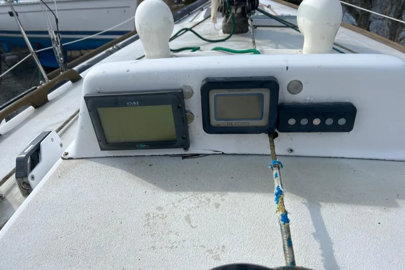 Slide: The Image of Control panel on 1986 Alsberg Brothers Express 37 sailboat deck with navigation instruments. - 8