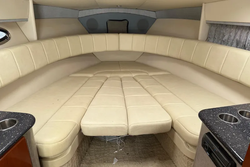 Slide: The Image of 2007 Formula 330 Sun Sport cabin interior with beige seating and kitchenette. - 11